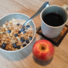 GF granola and cereal with almond milk, an apple, and coffee.
