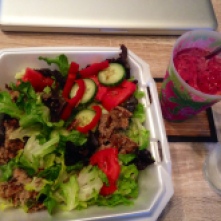 Salad with greens, red peppers, tomatoes, cucumbers, sunflower seeds, Amy's Sonoma veggie burger, and Annie's Chile Lime dressing. Paired with an all fruit smoothie with Plant Fusion Protein powder.
